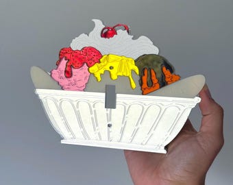 Tapa de interruptor de luz de acrílico con diseño de heladería y banana split de los años 90.