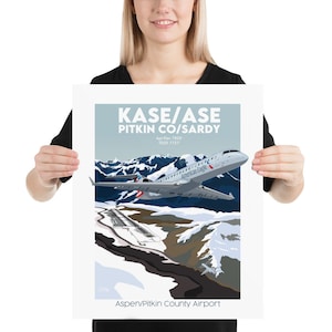 May include: A poster with a blue, white, and gray color scheme depicting a plane flying over a snowy mountain range. The text on the poster reads "KASE/ASE PITKIN CO/SARDY Apt Elev 7820 TDZE 7737 American Eagle Aspen/Pitkin County Airport".