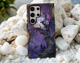 May include: A phone case featuring a fantasy scene with a black dragon perched on a gnarled tree branch under a full moon. The background is a deep purple with silhouetted trees. The case has a wood-like texture.