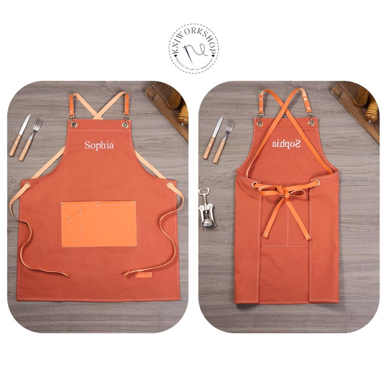 May include: Two rust-colored aprons with leather straps and pockets. One apron has the name "Sophia" embroidered on it. The other apron has the name "sidqo2" embroidered on it. The aprons are displayed with cutlery and a corkscrew.