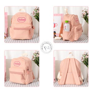 Puede incluir: Una mochila de color rosa claro con asa superior, correas ajustables para los hombros y un bolsillo frontal con cremallera. La parte delantera est&aacute; bordada con el nombre Aidan en un marco decorativo. Incluye bolsillos laterales.