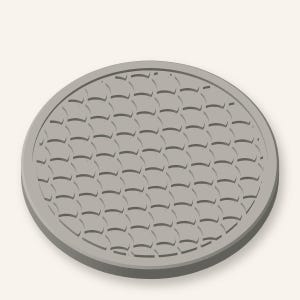May include: A circular, light gray coaster featuring a repeating, embossed scale pattern across its entire surface. The object has a smooth, raised outer rim that frames the textured, overlapping semi-circular design, creating a uniform appearance.