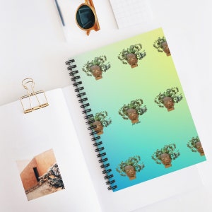May include: A spiral bound notebook with a gradient background of yellow, green, and blue. The cover features a repeating pattern of a brown ceramic head with green plants growing out of it. The text "pot head" is printed in white on the cover.