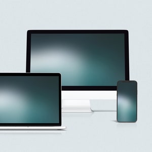 May include: A desktop computer, laptop, and smartphone, all with blurred backgrounds, are arranged in a row on a light gray surface.