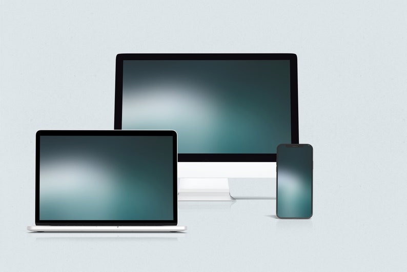 May include: A desktop computer, laptop, and smartphone, all with blurred backgrounds, are arranged in a row on a light gray surface.
