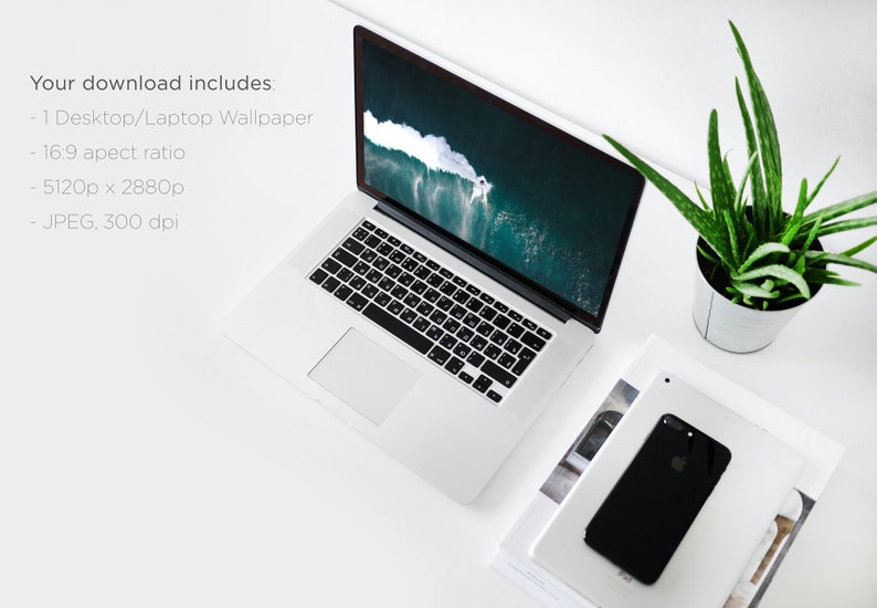 Puede incluir: Un ordenador port&aacute;til blanco con un teclado negro y una pantalla que muestra una foto de una ola rompiendo en el oc&eacute;ano. El port&aacute;til est&aacute; sobre una superficie blanca con una pila de revistas y una planta de aloe vera en maceta.
