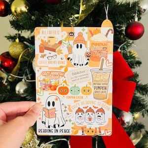 May include: A rectangular sticker with fall-themed illustrations and text. The sticker features images of ghosts, pumpkins, coffee, and books. Text includes "All I Need Is Coffee and My Books," "Cozy Bookish Weekend," and "Reading in Peace."