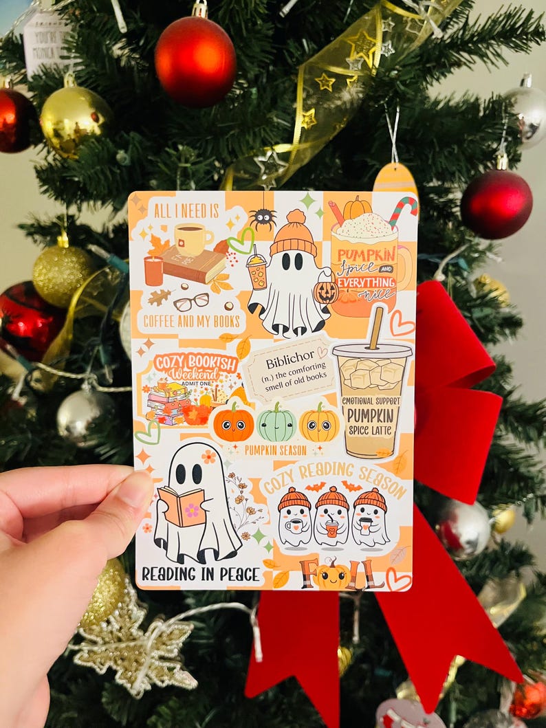 May include: A rectangular sticker with fall-themed illustrations and text. The sticker features images of ghosts, pumpkins, coffee, and books. Text includes "All I Need Is Coffee and My Books," "Cozy Bookish Weekend," and "Reading in Peace."