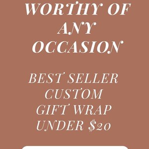 May include: Gift-wrapped present with a western-themed design. The wrapping paper features illustrations of horses, cowboys, and horseshoes. Tied with twine, the gift is set against a backdrop of pine needles and pine cones.