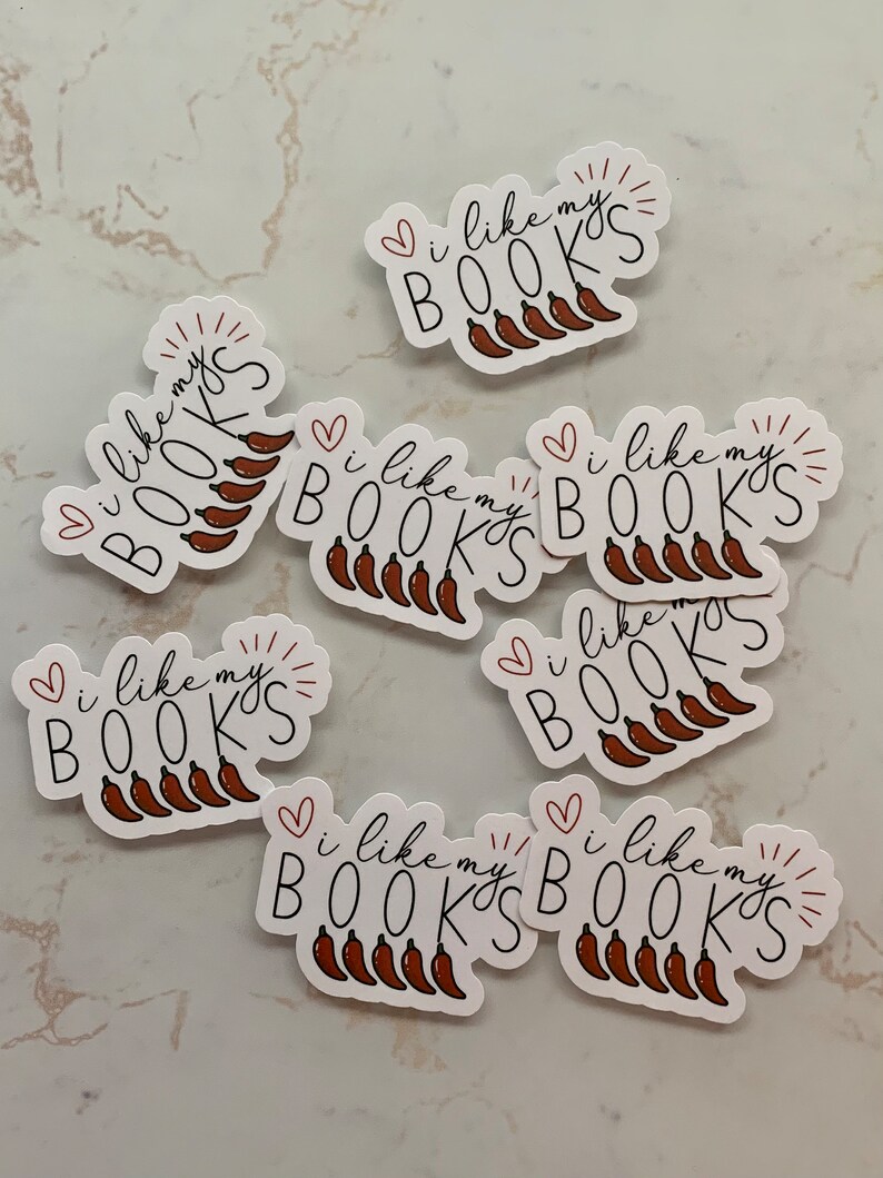 May include: Eight white stickers with the text "I like my BOOKS" and a red heart and a red sunburst. Each sticker has a row of five red chili peppers.