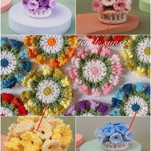 May include: A collection of crocheted flower arrangements in various colours, including purple, pink, yellow, blue, green, and orange. The flowers are arranged in a circular pattern and have a delicate, feminine appearance. The text "Gentle sunset" is visible in the image.