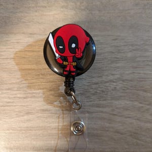 Bobine d'insigne du signe de la paix Deadpool