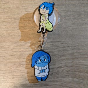 Inside Out Deluxe Happiness and Sadness Badge Reel