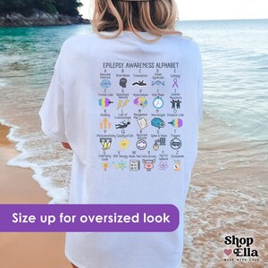 epilepsy awareness shirt with awareness alphabet A-Z. Purple ribbon month t-shirt on ivory comfort colors tee oversized on white shirt back design