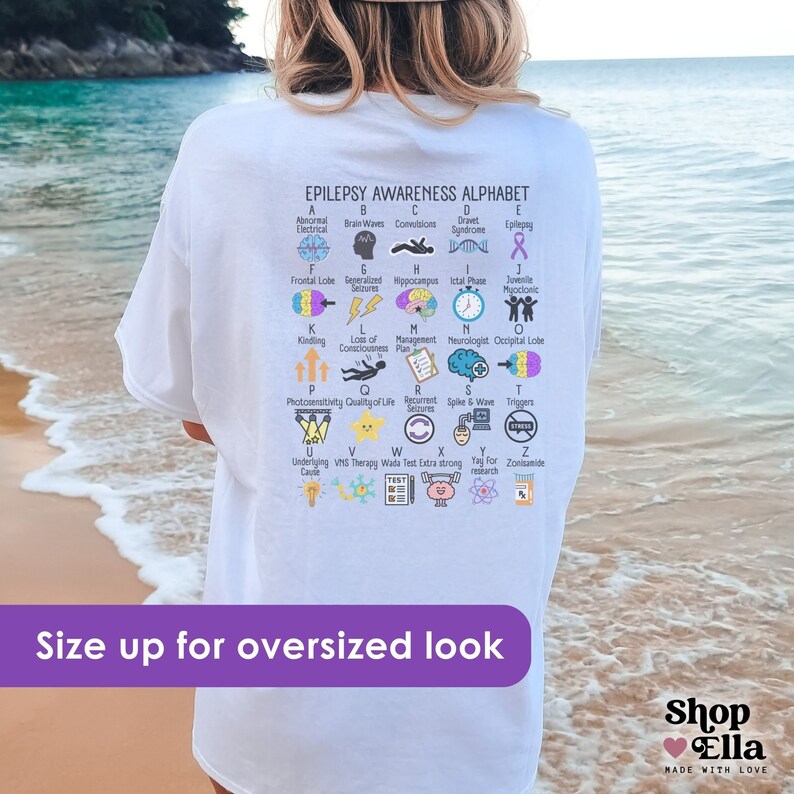 epilepsy awareness shirt with awareness alphabet A-Z. Purple ribbon month t-shirt on ivory comfort colors tee oversized on white shirt back design