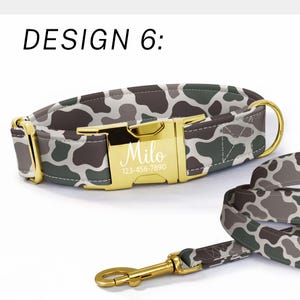 May include: Camouflage pattern dog collar and leash set. The collar features a gold-colored buckle engraved with a name and phone number. The pattern includes shades of green, brown, and gray. The text "DESIGN 6:" is at the top.