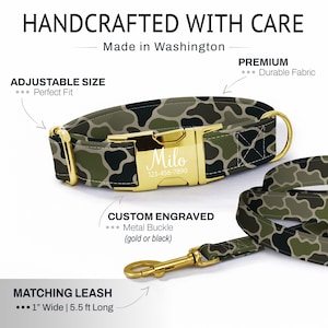 May include: Camouflage dog collar with a matching leash. The collar has a gold metal buckle engraved with "Milo" and a phone number. The leash is 1" wide and 5.5 ft long. The text "HANDCRAFTED WITH CARE" and "Made in Washington" are visible.