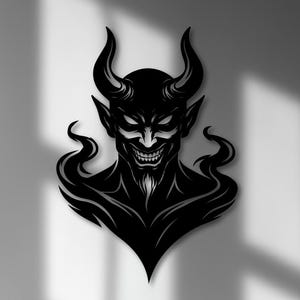 May include: Black metal wall art depicting a devil with horns, a sinister grin, and flowing hair. The artwork is mounted on a white wall above a dark wood cabinet with decorative items.
