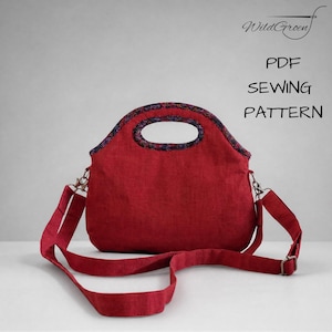 Op de afbeelding: Een rode handtas met een donkere rand met patroon rond de handgreepopening en een bijpassende verstelbare schouderriem. De tekst WildGroen PDF SEWING PATTERN is zichtbaar in de rechterbovenhoek van de afbeelding.