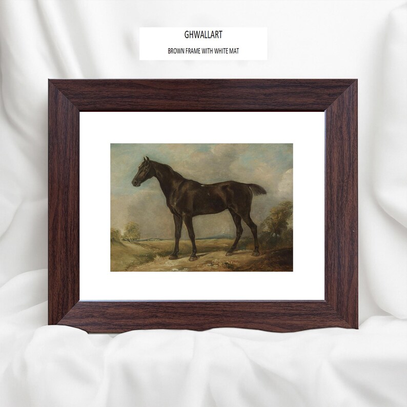May include: A framed print featuring a dark brown horse in a landscape setting. The artwork is set within a brown frame with a white mat. The text "GHWALLART BROWN FRAME WITH WHITE MAT" is visible at the top.