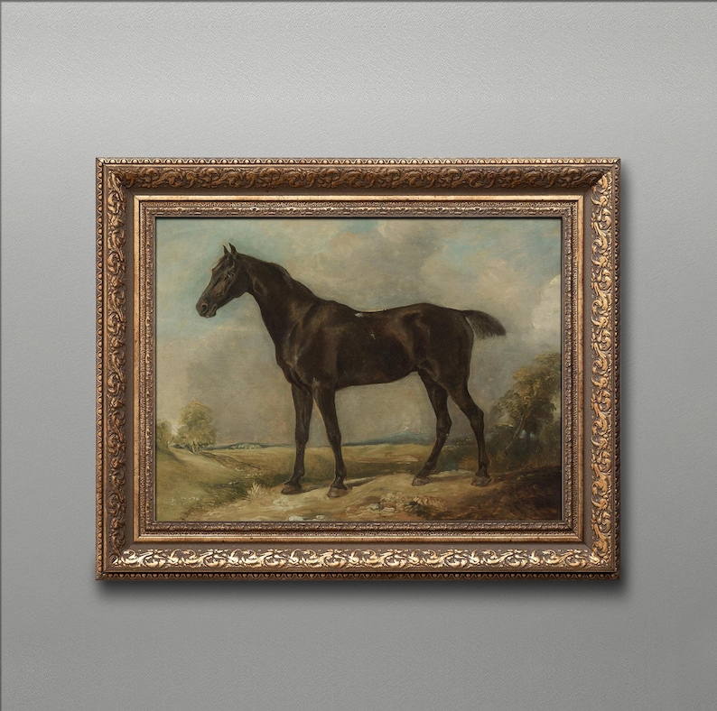 May include: An antique framed painting of a dark brown horse standing in a field. The horse is the focal point, set against a backdrop of a cloudy sky and rolling hills. The frame is ornate with a gold finish.