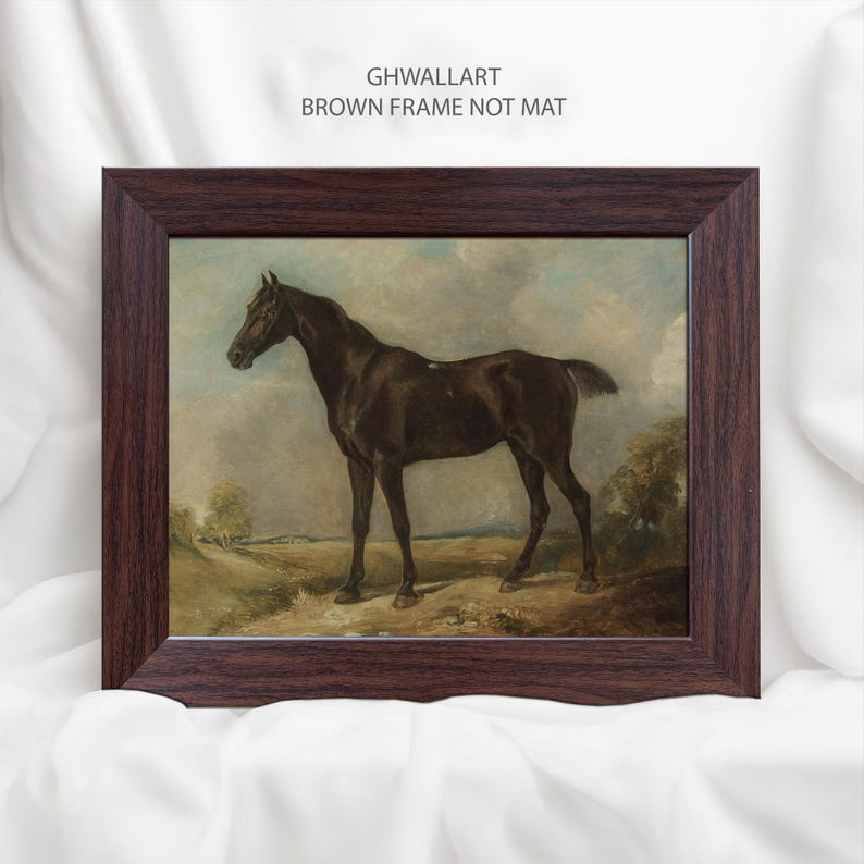 May include: A framed print of a dark brown horse standing in a field, set against a cloudy sky. The artwork is in a dark brown wooden frame. The text "GHWALLART BROWN FRAME NOT MAT" is printed at the top.
