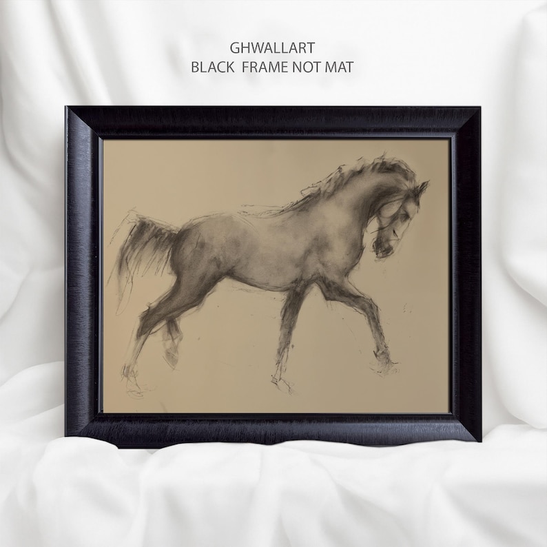 May include: Black framed artwork featuring a charcoal sketch of a horse in motion. The horse is depicted in shades of gray against a tan background. The text "GHWALLART BLACK FRAME NOT MAT" is printed at the top of the frame.