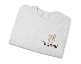 May include: A heather grey t-shirt with a graphic of a cocktail glass and the word "Negroni" printed on the front.