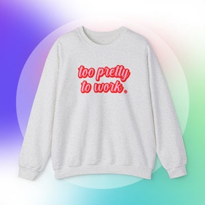May include: A gray sweatshirt with the text "too pretty to work" in red and pink lettering.