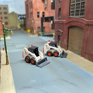 1/87 (HO Scale) Bobcat Skid Steer loaders. Custom built 3D printed resin model.
