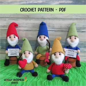 May include: Five crocheted gnome dolls with white beards, wearing pointed hats in red, green, blue, yellow, and green. Two gnomes hold signs reading There's NO Place like GNOME and GNOME SWEET GNOME. Others hold a red heart, a fish, and a mushroom.