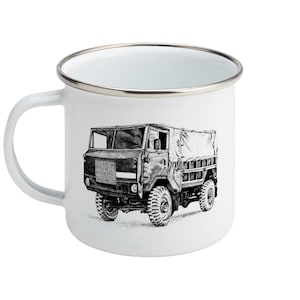 May include: White enamel mug with a black and white line drawing of a military truck. The truck has a canvas top and is driving on a dirt road.
