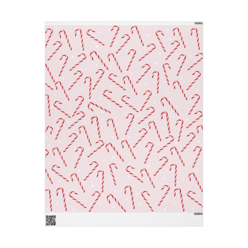 May include: A pink background with a repeating pattern of red and white candy canes. The candy canes are scattered randomly across the background.