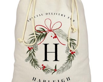 Saco de Papá Noel con corona navideña y nombre personalizado / Nombre e inicial personalizables / Medias navideñas Bolsa de regalo de lona / Cintas Follaje