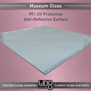 May include: A clear glass sheet with the text "SIDE THIS SIDE FACES FOR" printed on the edge. The glass is designed for museum use and offers 99% UV protection and an anti-reflective surface. Standard and custom sizes are available.