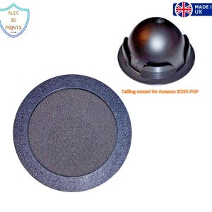 May include: Acoustic device accessories, including a dark gray circular speaker cover and a black ceiling mount for an Amazon Echo Pop. The speaker cover has a textured center and a glittery border. The ceiling mount is dome-shaped.