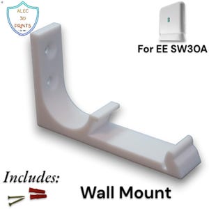 May include: A white wall mount for an EE SW30A device. The L-shaped mount has a curved support and includes screws and wall plugs. The text "Wall Mount" is displayed.