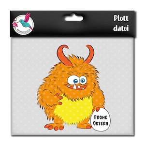May include: Orange and yellow fuzzy monster holding a sign that says "Frohe Ostern" which is German for "Happy Easter".