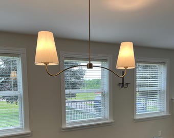 Brass Elegance with Linen Grace Shade A Timeless Chandelier for Distinctive Spaces