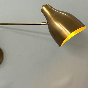 Timeless Elegance Illuminated Handcrafted Raw Brass Wall Lamp