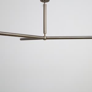 Mid Century Modern The Timeless Elegance of Brass Y Shaped Chandeliers