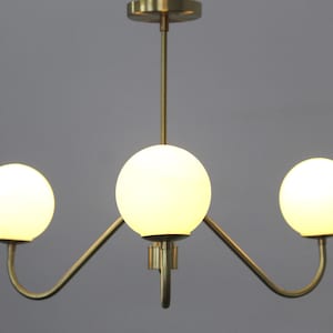 Luminous Elegance The Enchanting Brass Milky Ball Chandelier