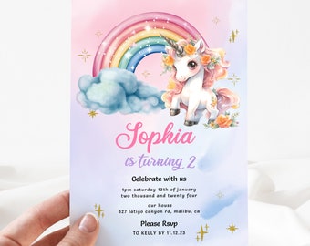 May include: A pink and blue birthday invitation with a rainbow and a unicorn. The invitation says "Sophia is turning 2. Celebrate with us 1pm saturday 13th of january two thousand and twenty four our house 327 latigo canyon rd, malibu, ca Please Rsvp TO KELLY BY 11.12.23"