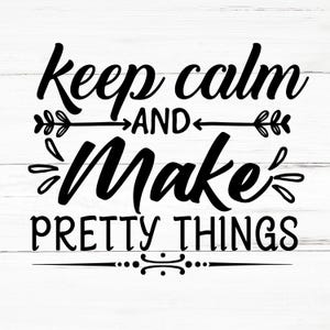 May include: Black and white typography on a white wood background. The text reads "Keep calm and make pretty things".
