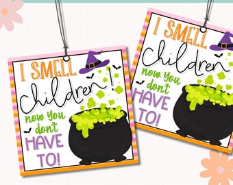 May include: Two Halloween-themed gift tags with the text "I SMELL children! now you don't HAVE TO!" in orange, black, and green. Each tag features a witch's hat, bats, and a bubbling cauldron. The tags have a pink and orange border.