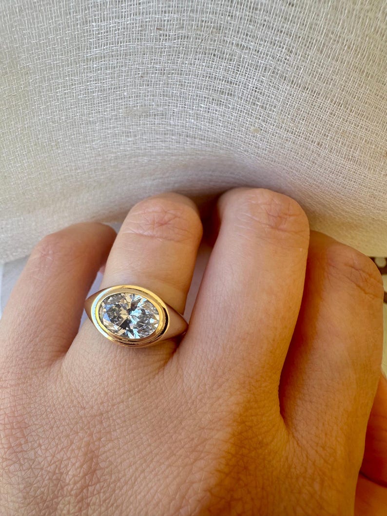 18K Oval Lab Diamond Ring, in a Signet Ring style featuring a bezel set 2ct Oval Lab Diamond | Ella Creations Jewelry