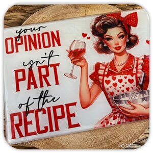 May include: A white cutting board with a red and black graphic that says "Your opinion isn't part of the recipe". A cartoon woman in a red dress and apron is holding a glass of red wine and a mixing bowl.