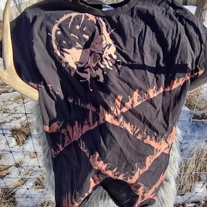 Bleach dyed slashed skull graphic T-shirt.