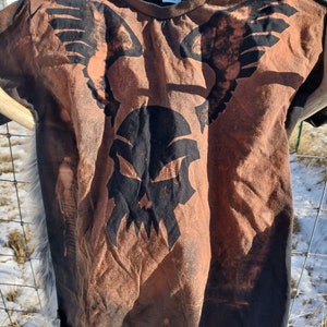 Bleach dyed winged skull graphic T-shirt.
