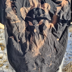 Bleach dyed winged skull graphic T-shirt.